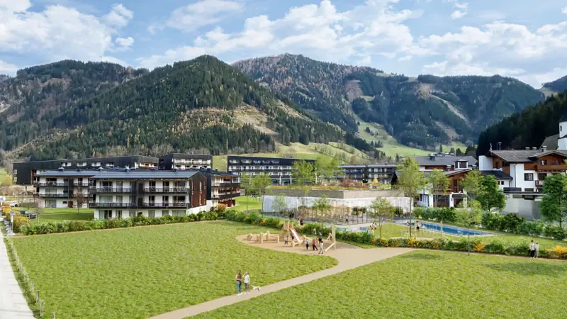 Badehaus Werfenweng Gebäudekomplex vom Badehaus Werfenweng mit Wiesen, Spielplatz, aja Bergresort Werfenweng und Außenpool